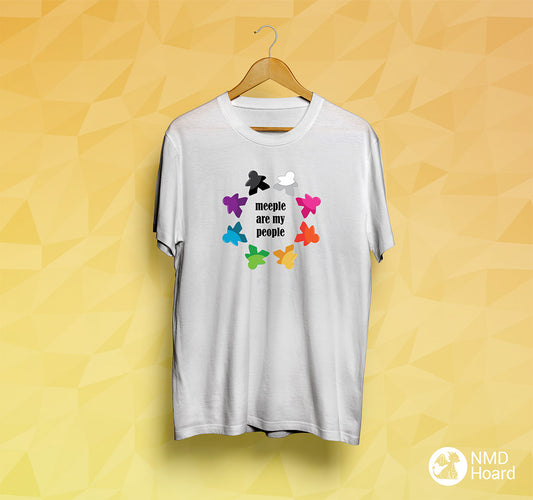 White t-shirt with a circular rainbow of meeple shapes with the text 'Meeple are my people' on a yellow background.