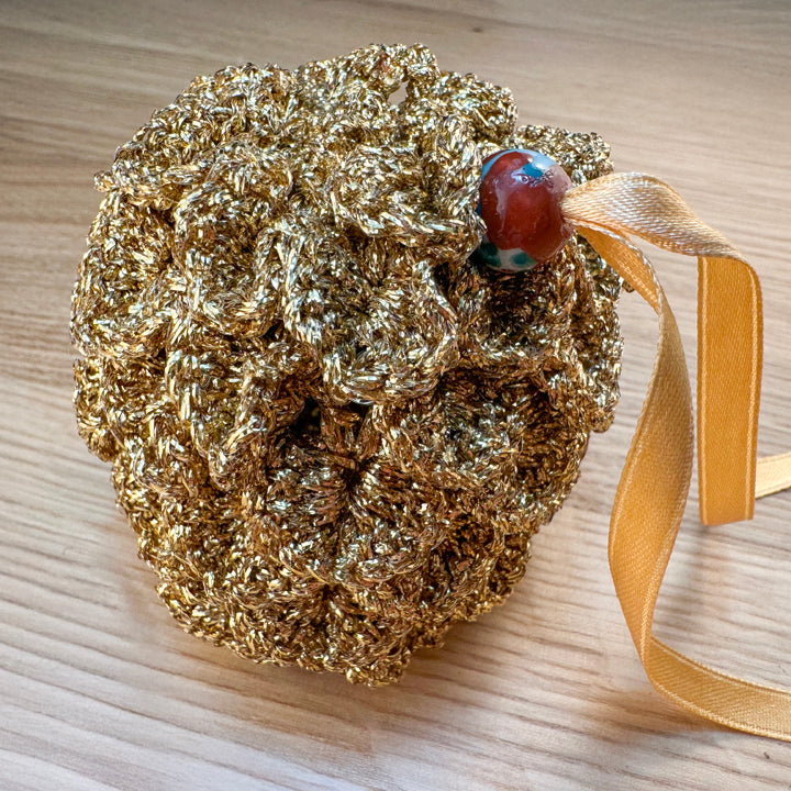 Closed mini gold dragon egg crochet pouch, part of the handmade hoard and Fateweaver's collection